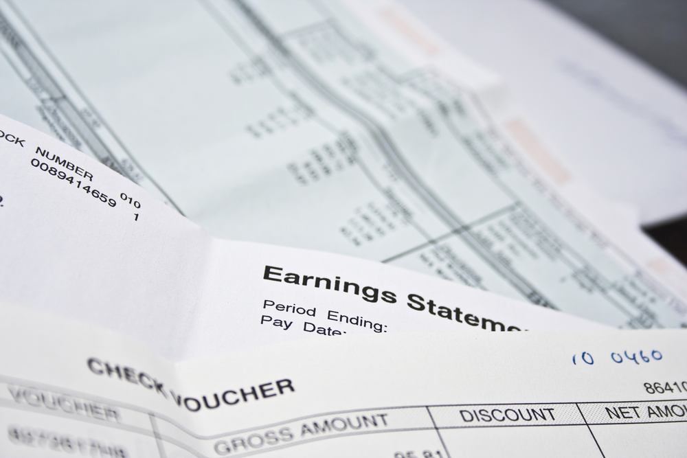 Earning statements from a pay check stub.